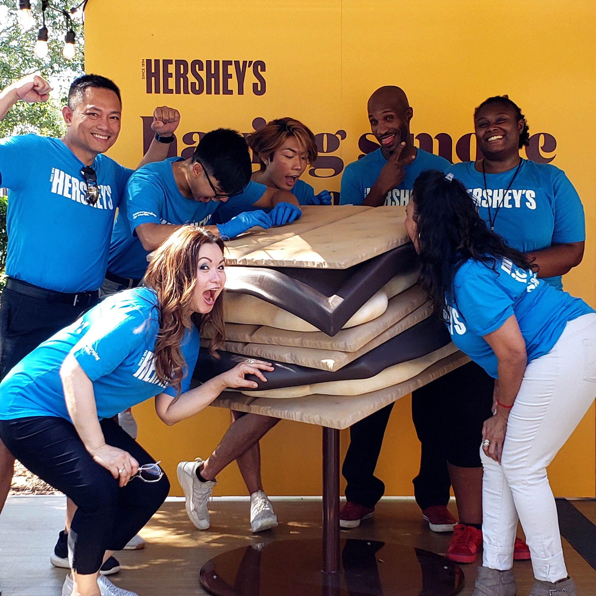 Group of brand ambassadors posing with the life size s'more