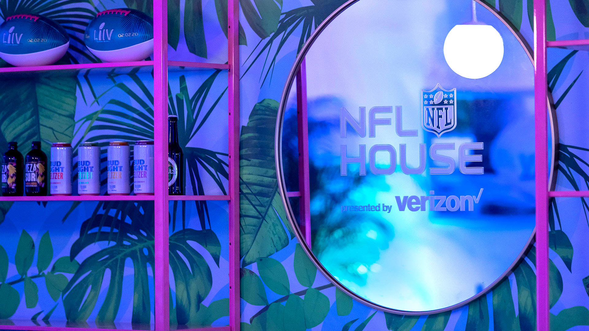 NFL House mirror on a wall with large leaves